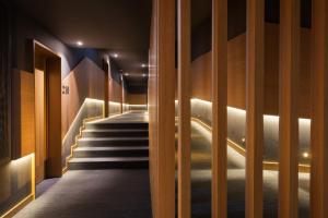 a staircase in a building with lights on the wall at Eurostars Porto Centro in Porto