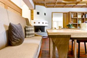 a living room with a couch and a table at Hotel Gasthof KREUZ in Sonntag