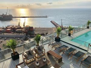 a view of the ocean from a hotel balcony at RQ Antofagasta in Antofagasta