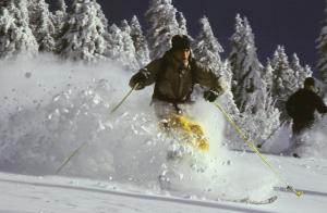 a man is skiing down a snow covered slope at Azureva Métabief in Métabief