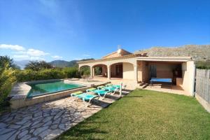 a backyard with a swimming pool and a house at Can Jaume in Pollença