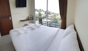 Ένα ή περισσότερα κρεβάτια σε δωμάτιο στο Top Hostel Samui