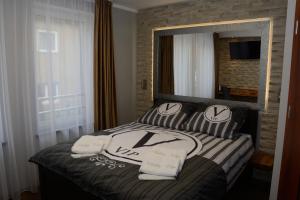 Posteľ alebo postele v izbe v ubytovaní Villa Vip Pokoje Apartament