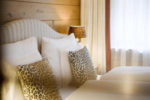 Postel nebo postele na pokoji v ubytování Das Georg Boutique-Hotel
