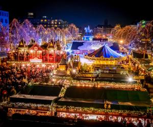 an aerial view of a christmas market at night at XII Apostel Albergo in Cologne +27 photos