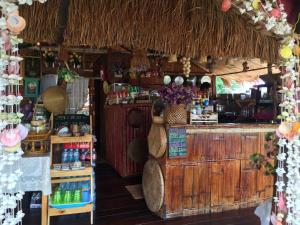 a shop with a counter and a bar in a store at Sweet Home Floating House in Ban Lum Le