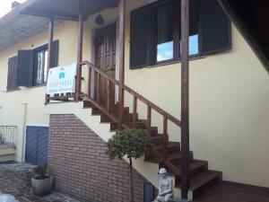 a stairway leading to a building with a stair case at Happy House in Coppito