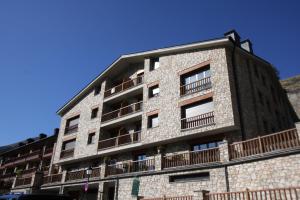 a building with balconies on the side of it at Apartamentos Grifo Vacances Julia in El Tarter