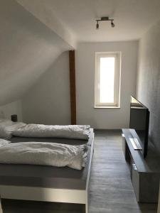 Postel nebo postele na pokoji v ubytování Monteur- und Ferienwohnung