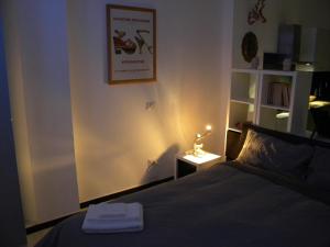 Posteľ alebo postele v izbe v ubytovaní Bologna House Pratello 5