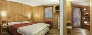 Postel nebo postele na pokoji v ubytování Hotel Pedranzini