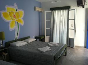 En eller flere senge i et værelse på Pelagos