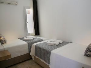 A bed or beds in a room at Rhapsody Hotel Kas