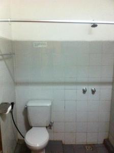 a bathroom with a white toilet in a stall at Mandala Wisata Hotel in Solo +47 photos