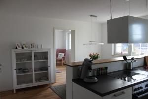 a kitchen with a counter top and a stove top oven at Ferienwohnung in herrlicher Lage in Bad Urach