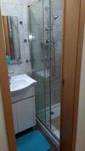 a bathroom with a shower and a sink and a showerspective at Al Gaia Centro Historico in Vila Nova de Gaia
