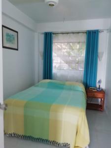 A bed or beds in a room at Apartment Espoir