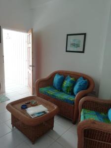 a living room with a couch and a coffee table at Apartment Espoir in Castries