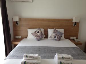 A bed or beds in a room at Rhapsody Hotel Kas