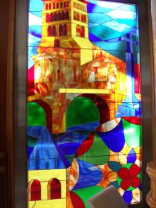 a painting of a colorful vase filled with colorful flowers at Hotel Camino Real in Arcahueja
