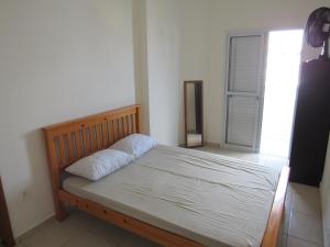 מיטה או מיטות בחדר ב-Apartamento Canto do Forte