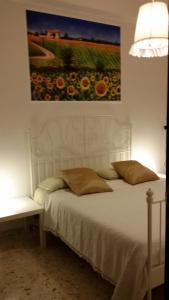 Postel nebo postele na pokoji v ubytování B&B Metropolitan Taranto