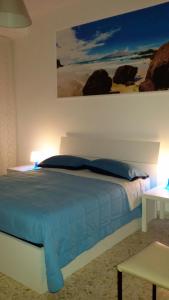 Postel nebo postele na pokoji v ubytování B&B Metropolitan Taranto