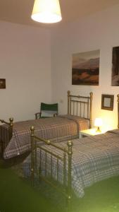Postel nebo postele na pokoji v ubytování B&B Metropolitan Taranto