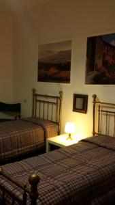 Postel nebo postele na pokoji v ubytování B&B Metropolitan Taranto