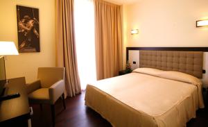 Postel nebo postele na pokoji v ubytování Hotel Le Macine + 28 fotografií