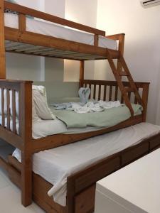 Postel nebo postele na pokoji v ubytování Laguna Beach vista para a piscina + 43 fotografií