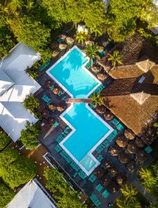 an overhead view of a swimming pool at a resort at Playabachata in San Felipe de Puerto Plata