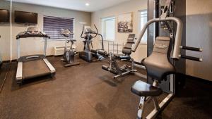 a gym with several tread machines in a room at Best Western Crown Inn & Suites - Batavia in Batavia
