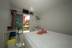 Voodi või voodid majutusasutuse Maenam Villa Hotel toas
