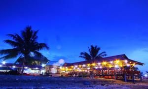 a building on the beach at night at DD Empire Homestay in Kuala Selangor