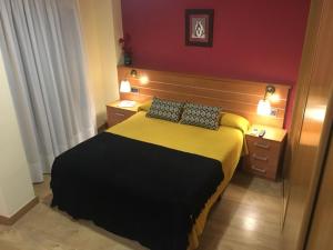 Posteľ alebo postele v izbe v ubytovaní Hostal Doña Juana