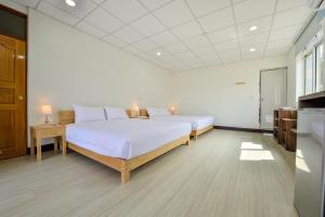 Una cama o camas en una habitación de Ta Li Wen B&B