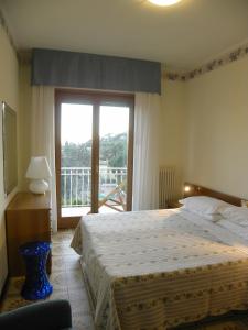 En eller flere senge i et værelse på Residence i Morelli