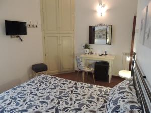 Postel nebo postele na pokoji v ubytování Agriturismo Il Cavallino Saturnia