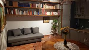 a living room with a couch and a table at La Suite dei Ricordi in Impruneta