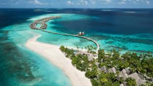 an aerial view of a resort in the ocean at JOALI Maldives in Raa Atoll