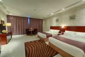 Una cama o camas en una habitación de Grand Mayral Hotel 95 fotos más