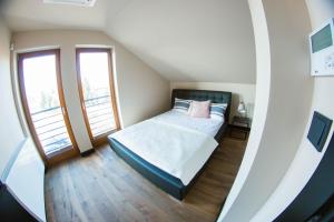 Posteľ alebo postele v izbe v ubytovaní Colorful Apartments Pułtusk