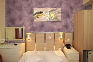 Krevet ili kreveti u jedinici u okviru objekta Socrates Hotel