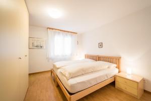 Ένα ή περισσότερα κρεβάτια σε δωμάτιο στο LAAX Homes - Val Mulin 8,2 - Scarpazza