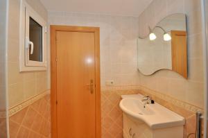 a bathroom with a sink and a mirror at Vista panorámica in Lloret de Mar +23 photos