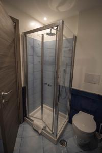 a shower stall in a bathroom with a toilet at ChiàRò-La casa al mare in Minori