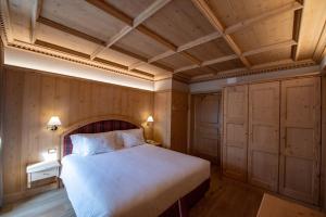 Un pat sau paturi într-o cameră la Hotel San Lorenzo