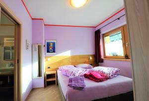 En eller flere senge i et værelse på Cà del Romeo