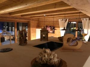 a living room with a table with wine glasses at Lachtalchalet in Oberwölz Stadt